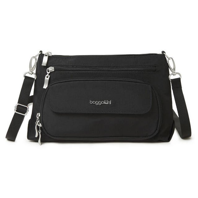 The Baggallini Original Everyday Bag is a compact, black crossbody bag featuring multiple zippered pockets and an adjustable strap. It's designed for organization and convenience, with a front flap pocket for easy access to essentials.