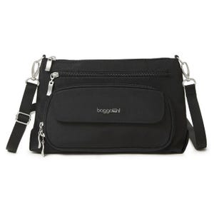 The Baggallini Original Everyday Bag is a compact, black crossbody bag featuring multiple zippered pockets and an adjustable strap. It's designed for organization and convenience, with a front flap pocket for easy access to essentials.