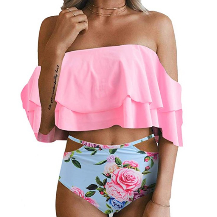 A swimsuit featuring a pink, off-the-shoulder ruffled top and high-waisted floral bottoms with a blue background and rose designs.