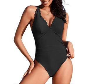 A black one-piece swimsuit featuring scalloped edges and a V-neck design.