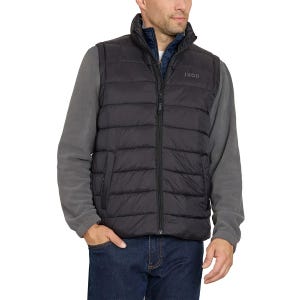 A man is wearing a dark gray Izod puffer vest over a gray long-sleeve shirt, paired with blue jeans. The vest has a zippered front and the Izod logo on the left chest.
