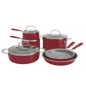 A red cookware set with multiple pieces, including two frying pans, a large stockpot, a saucepan, and a sauté pan, all equipped with glass lids and red handles.