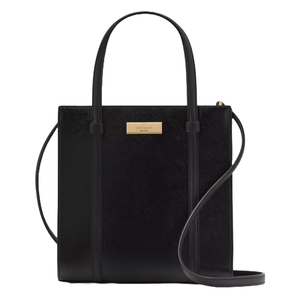 The Kate Spade Kenzie Small Tote is a black, structured handbag featuring dual top handles, a crossbody strap, and a gold-tone logo plaque on the front. It has a sleek, textured finish.