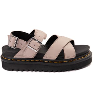 A platform sandal with a light pink double-strap design, silver buckles, and a thick black sole featuring yellow stitching detail.