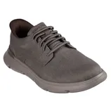A gray casual sneaker with a textured fabric upper, lace-up design, and a cushioned, slightly elevated sole.