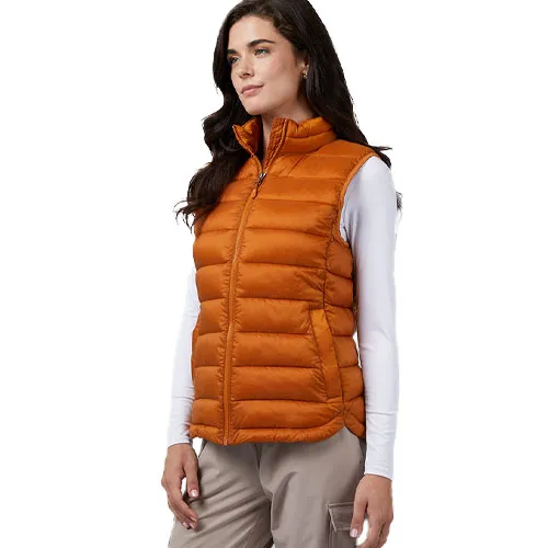 A woman is wearing a sleeveless, orange packable vest with a zip-up front and a high collar. The vest has a quilted design and side pockets.