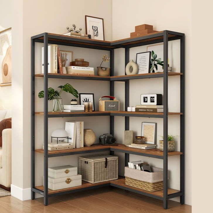VASAGLE corner bookshelf with a black metal frame and wooden shelves, styled with books, plants, and decorative items beside a cozy living room setting.