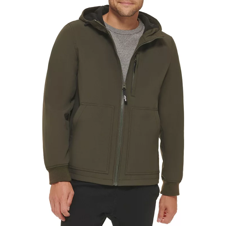 A person wears a dark olive hoodie with a full zip, featuring a hood and pockets.