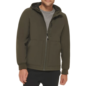 A person wears a dark olive hoodie with a full zip, featuring a hood and pockets.