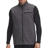 A man wearing a gray Under Armour zip-up vest with black trim and a chest pocket, over a black long-sleeve shirt.