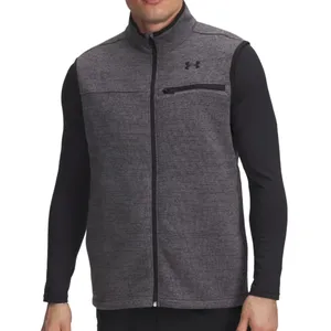 A man wearing a gray Under Armour zip-up vest with black trim and a chest pocket, over a black long-sleeve shirt.