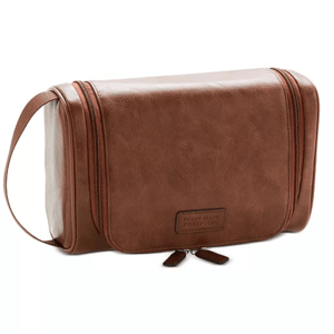 Brown leather shave kit with a zippered closure, carrying handle, and embossed Perry Ellis Portfolio logo.