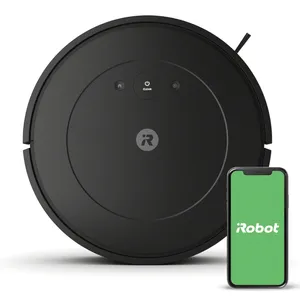 A black iRobot Roomba vacuum cleaner is shown with a smartphone displaying the iRobot app, indicating smart control capabilities.