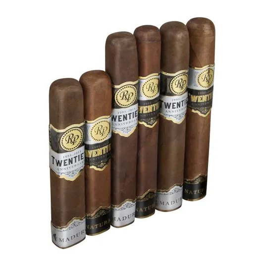 A collection of cigars from the \“Twentieth Anniversary\“ series by a brand with initials RP, featuring both \“Natural\“ and \“Maduro\“ varieties, wrapped with decorative bands indicating the years 1995-2015.