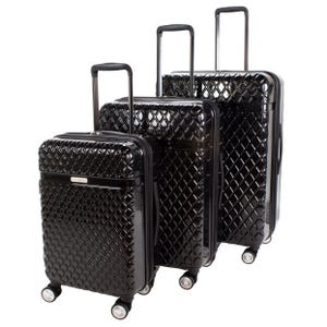Three black diamond-patterned hardside suitcases with retractable handles and four spinner wheels each. They vary in size, offering a coordinated set for travel needs.