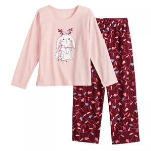Girls Cuddl Duds Fleece Pants Pajama Set features a pink long-sleeve top with a cute bunny illustration and matching burgundy pants with a whimsical pattern of stars and swirls.