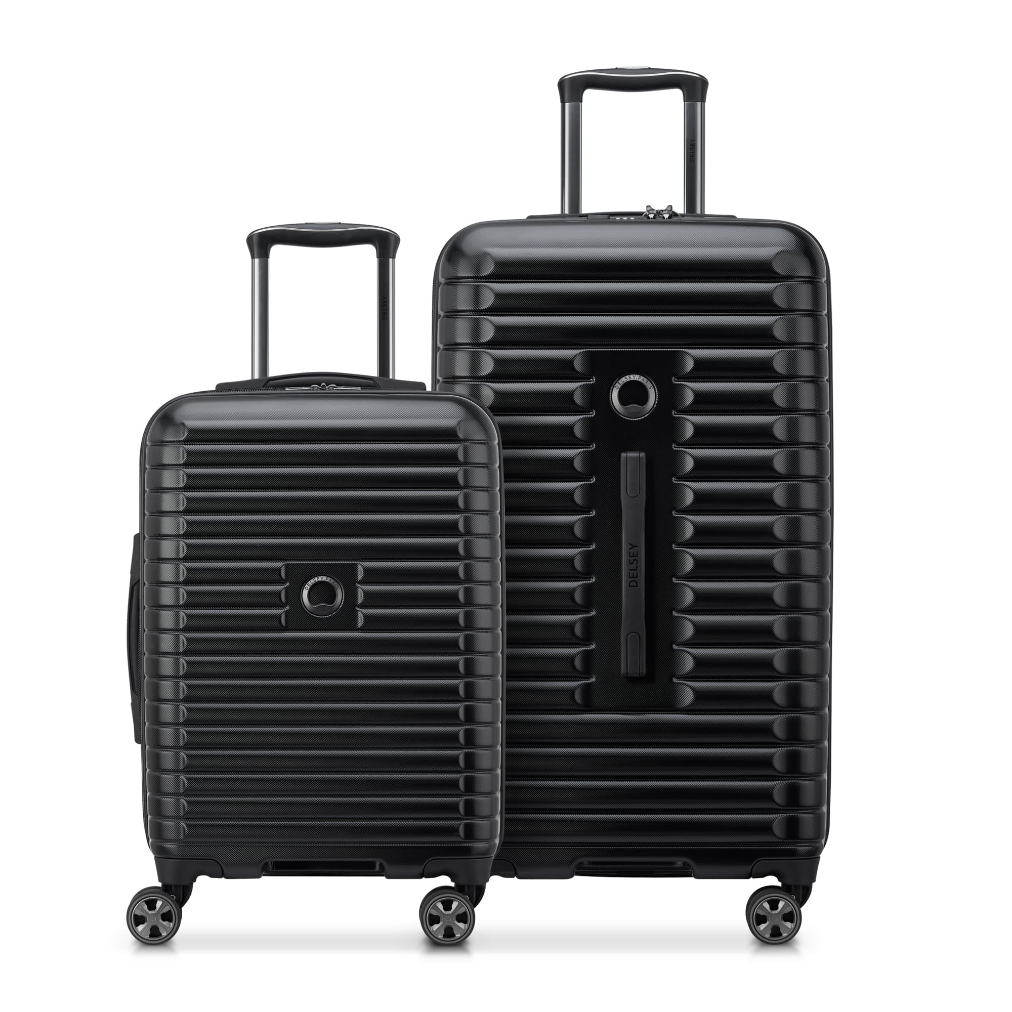 Two black hard-shell suitcases with textured horizontal ridges, featuring telescopic handles and spinner wheels for easy maneuverability.
