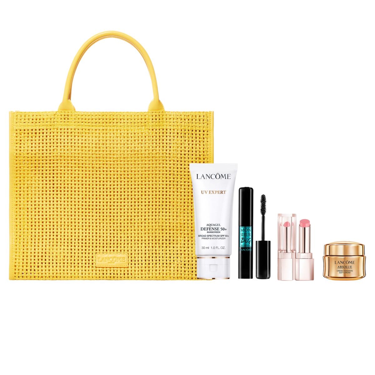 Yellow woven tote with Lancôme products: UV Expert AquaGel SPF 50, Monsieur Big mascara, lipsticks, and Absolue cream.