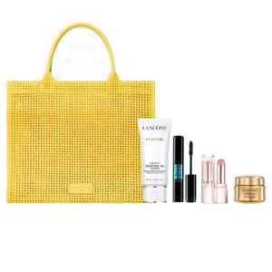 Yellow woven tote with Lancôme products: UV Expert AquaGel SPF 50, Monsieur Big mascara, lipsticks, and Absolue cream.