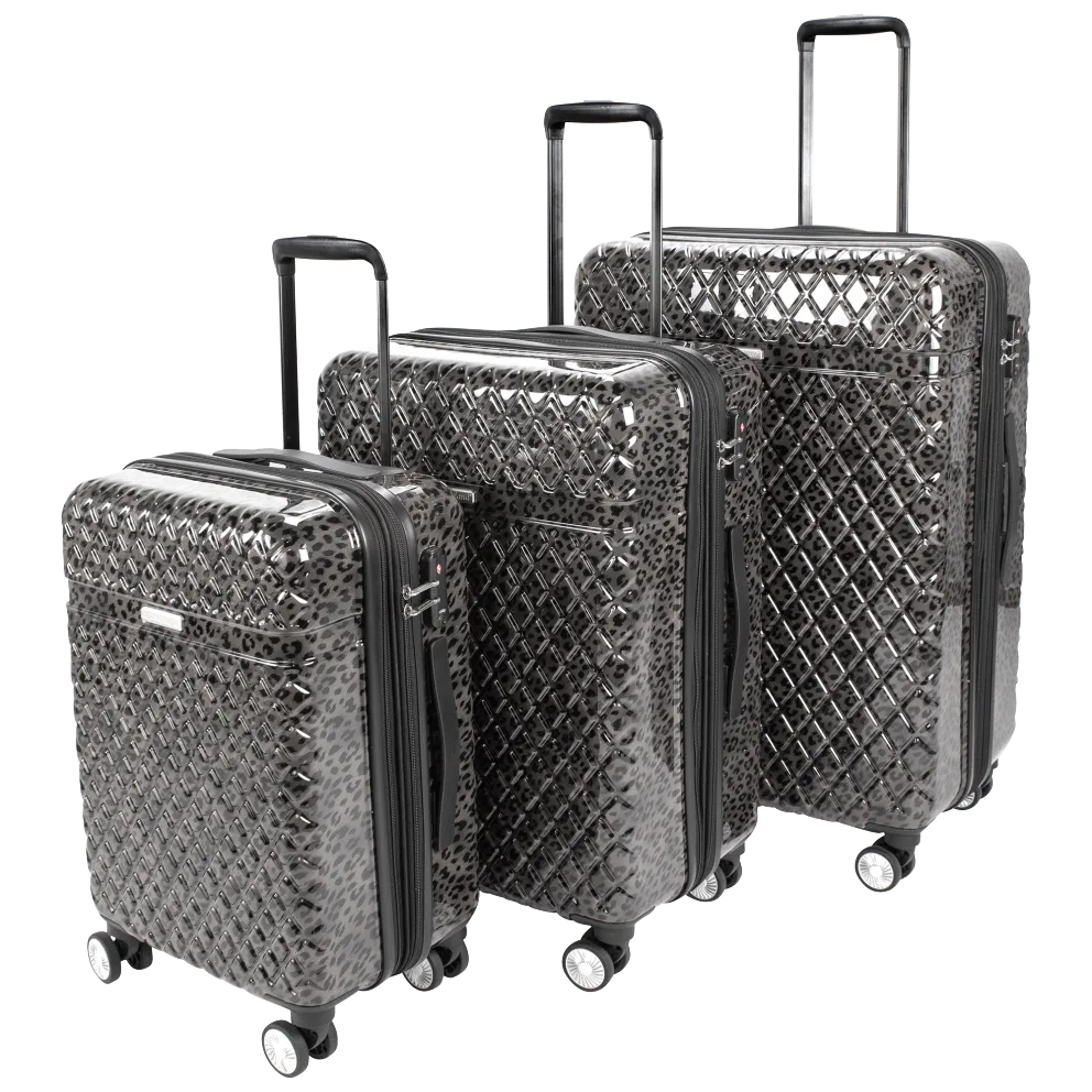 A 3-piece set of Kathy Ireland hardside luggage in a glossy, textured, black diamond pattern featuring four spinner wheels, retractable handles, and built-in combination locks.