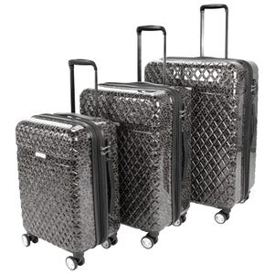 A 3-piece set of Kathy Ireland hardside luggage in a glossy, textured, black diamond pattern featuring four spinner wheels, retractable handles, and built-in combination locks.
