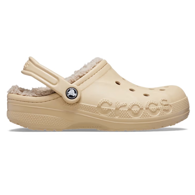 Beige Crocs clog with a fuzzy liner and a branded strap across the heel.