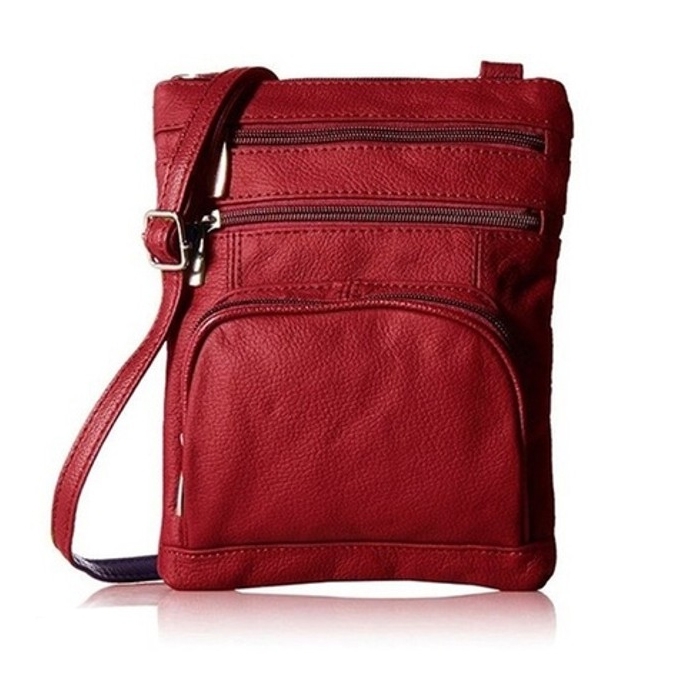 A red leather crossbody bag with multiple zippered compartments and an adjustable strap is shown.