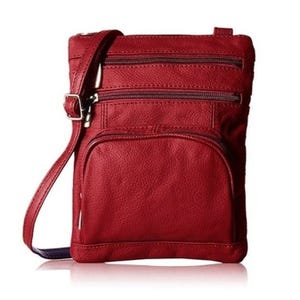 A red leather crossbody bag with multiple zippered compartments and an adjustable strap is shown.