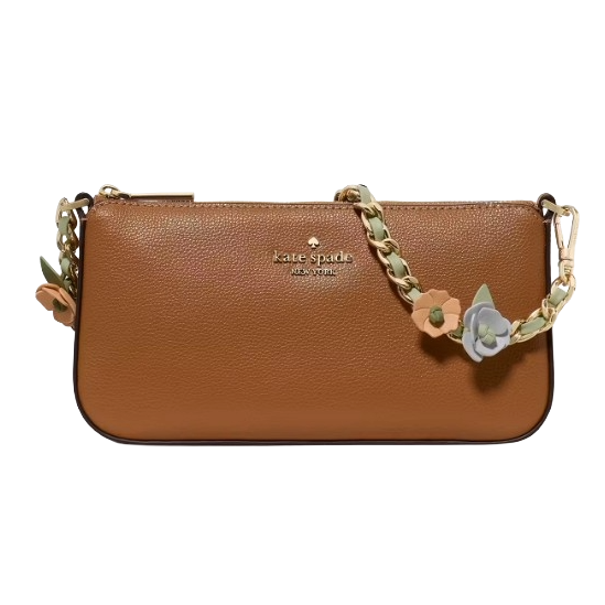 A brown leather Kate Spade shoulder bag features a decorative strap with floral accents, providing a stylish and elegant accessory option.