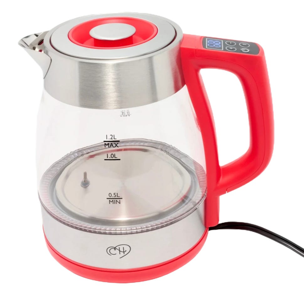Electric kettle with a red handle and base, stainless steel top, and clear glass body displaying water level indicators ranging from 0.5L to 1.2L.