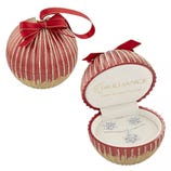 A red and gold ornament-shaped gift box with a bow contains a fine silver-plated jewelry set featuring a necklace and pair of stud earrings.