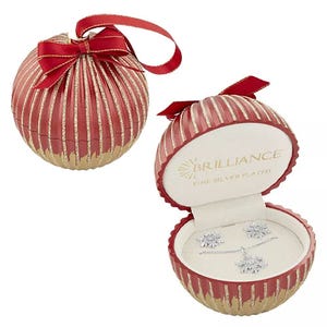 A red and gold ornament-shaped gift box with a bow contains a fine silver-plated jewelry set featuring a necklace and pair of stud earrings.