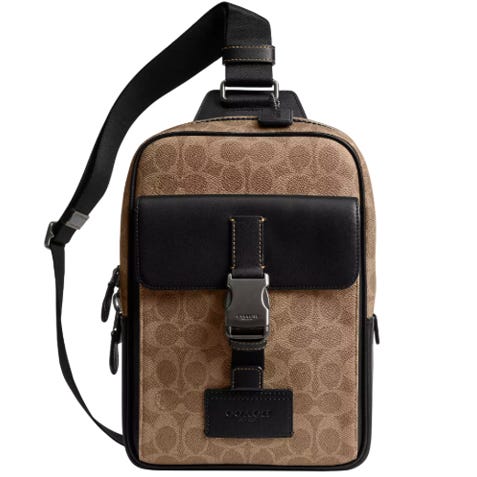 A brown and black crossbody bag with a front buckle and adjustable shoulder strap, featuring a signature pattern design.