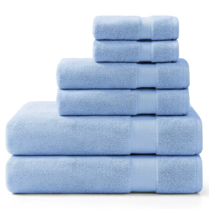 A stack of light blue towels in various sizes displayed in a pyramid arrangement.
