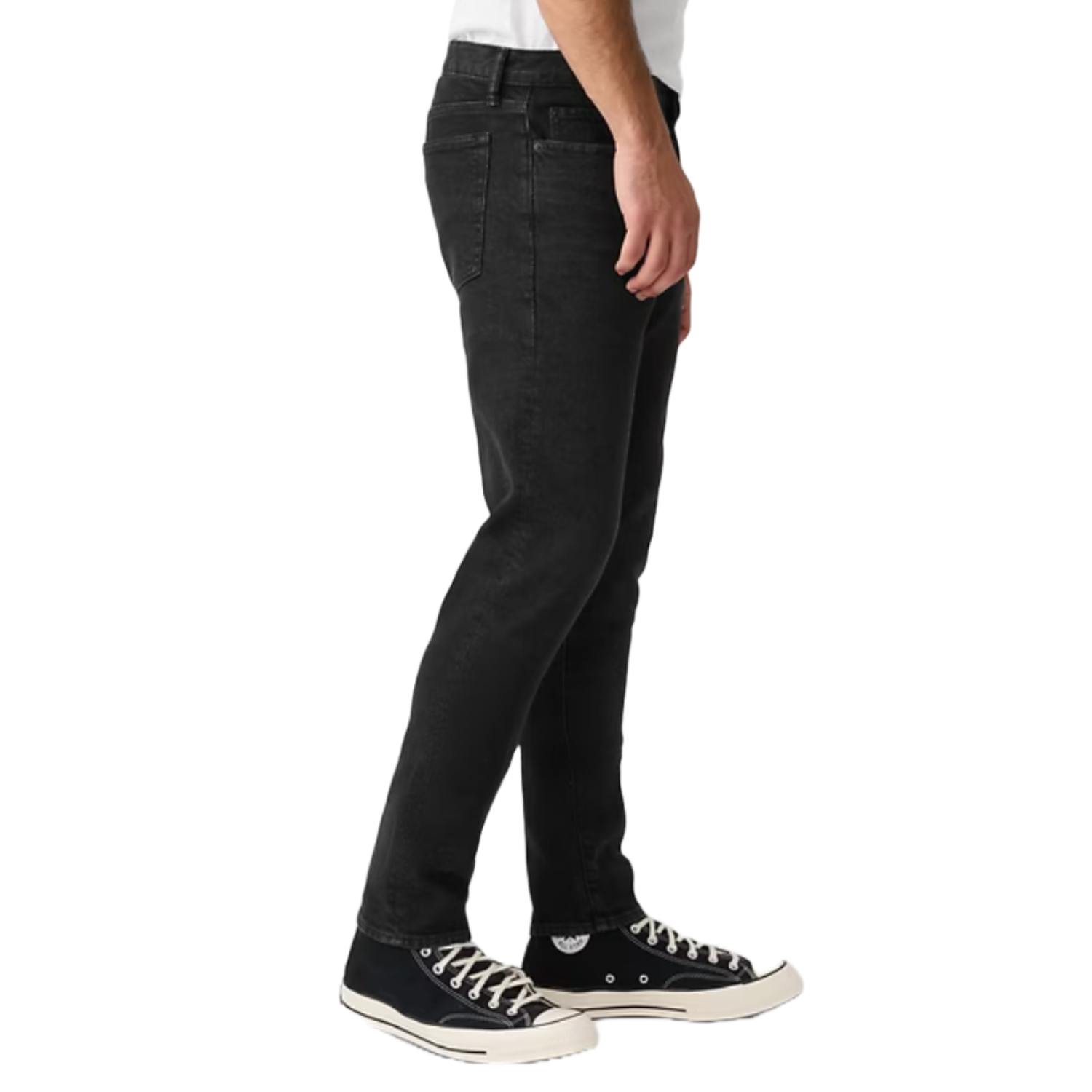 Black straight-fit jeans with a five-pocket design, paired with black and white high-top sneakers.