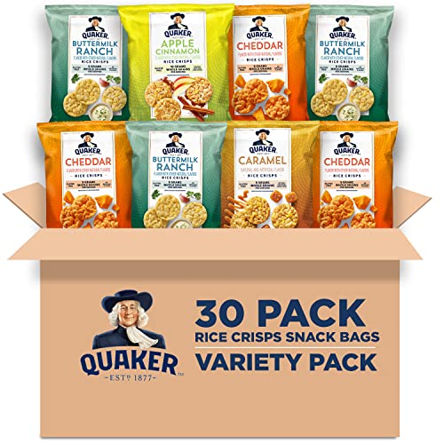 A variety pack of Quaker Rice Crisps in an open cardboard box displaying four different flavors: cheddar, caramel, apple cinnamon, and buttermilk ranch.
