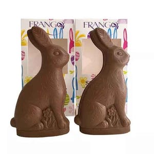 Frango 2k Solid Milk Chocolate Bunnies are packaged in decorative boxes with colorful patterns. Each bunny is intricately detailed, showcasing a classic rabbit shape.