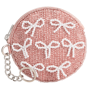 Round pink coin purse adorned with white beads shaped like bows, featuring a zipper closure and a metal keychain attachment.
