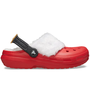 Red Crocs with a fuzzy white lining resembling Santa's attire, featuring a glittery black strap with gold trim and the Crocs logo on the side.