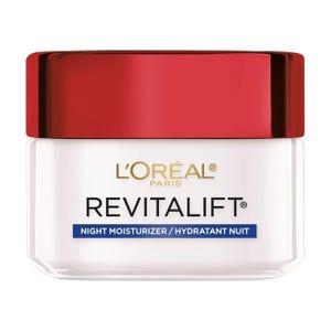 L'Oréal Paris Revitalift Night Moisturizer is a skin care product designed to hydrate and rejuvenate the skin overnight, packaged in a white jar with a red lid.