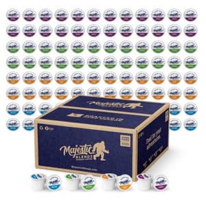 Majestic Blends coffee pods in various flavors are displayed, featuring a large box labeled \“100 pods\“ and several pods shown in the foreground.