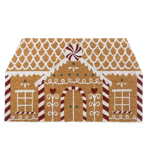 A doormat designed to resemble a gingerbread house, featuring decorative white icing patterns and red stripes.