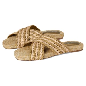 Nine West Animay Sandals feature crisscross woven straps in a natural beige color and a matching flat sole with braided detailing, creating a stylish and casual look.