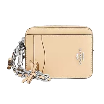 A small beige Coach cardholder with a chain strap features multiple card slots and the brand's logo.