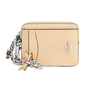 A small beige Coach cardholder with a chain strap features multiple card slots and the brand's logo.