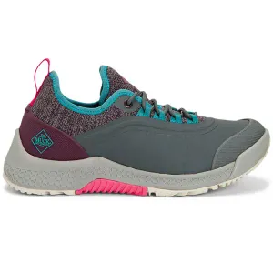The Original Muck Boots Sneakers feature a colorful design with a gray rubber sole, teal and pink accents, and a knit upper. They offer a casual, sporty look with durable materials for outdoor activities.