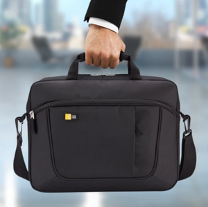 A person is holding a black laptop bag with a shoulder strap and a case logo.