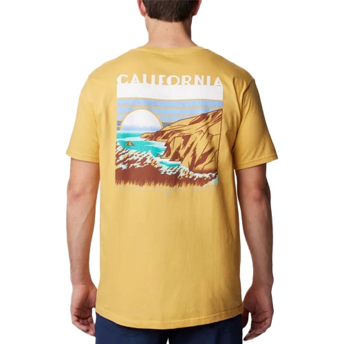 The Columbia Golden Nugget T-Shirt is a short-sleeve, yellow tee featuring a back graphic of a coastal landscape with mountains, ocean waves, and a setting sun, along with the word \“California\“ above it.