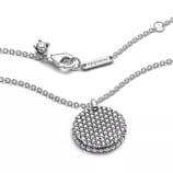 A silver Pandora necklace with a round, sparkling pendant and a branded tag near the clasp, featuring a lobster clasp closure.