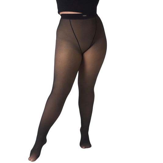 A person is wearing sheer black tights and a long-sleeved black crop top, showcasing the clothing.
